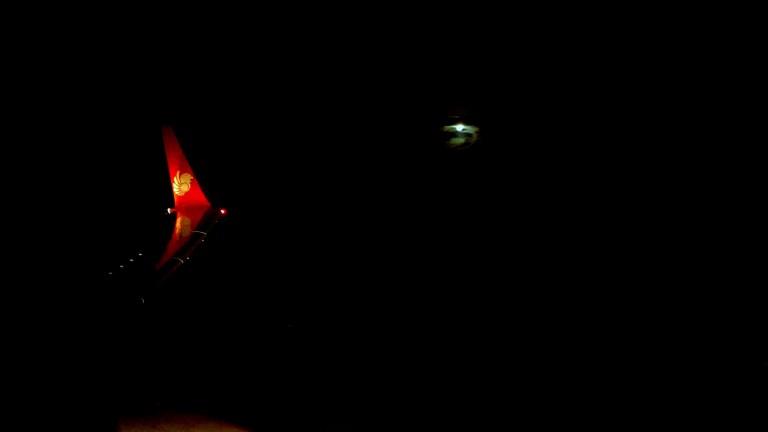 The moon rises as the plane flew over Natuna strait.