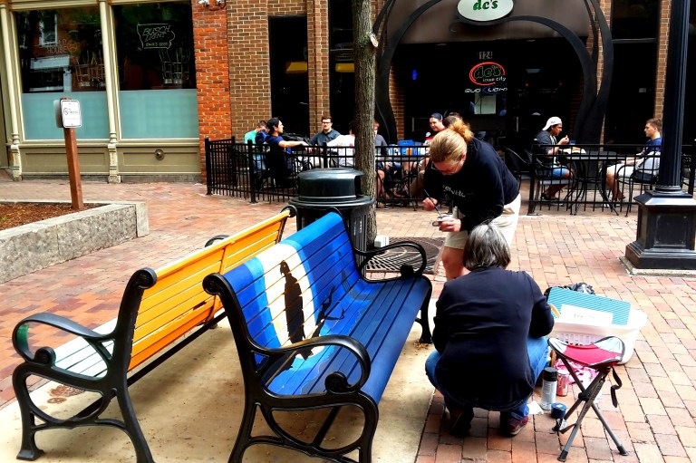Daily activities at PedMall. Artist painting at a community project called BenchMark 4.0.